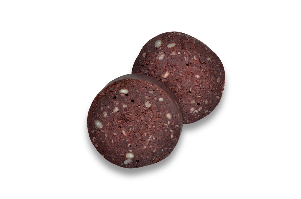 Two slices of black pudding from directly above isolated on white with clipping path