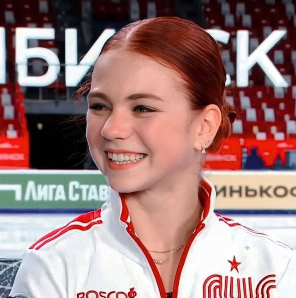 Alexandra Trusova smiling wearing jacket