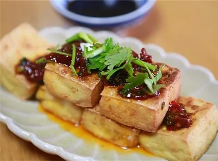 Stinky tofu is a fermented tofu dish with a pungent aroma that belies its mild taste