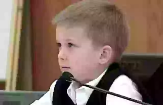 AJ Hutton, 7 years old, on the stand for the trial of his sisters murder.