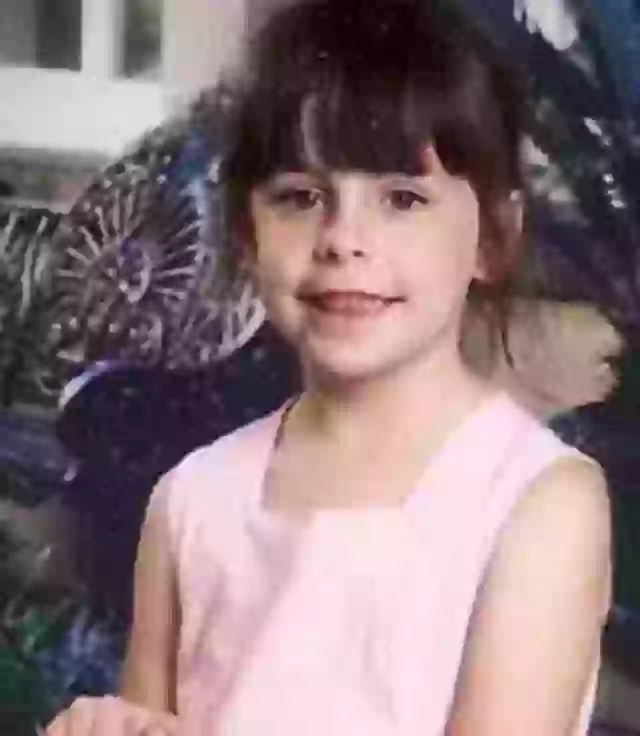 photo of Adrianna Hutto, smiling, in a pink top.