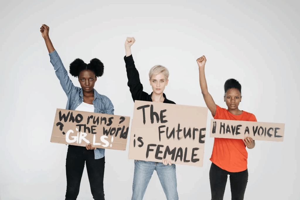 Feminists with Banners and Raised Hands