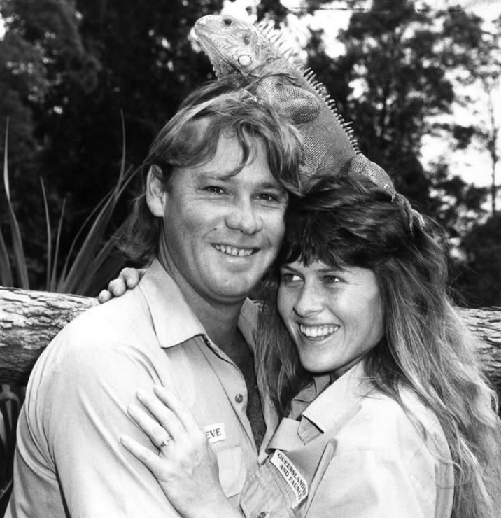 Terri and Steve Irwin with an iguana on their heads