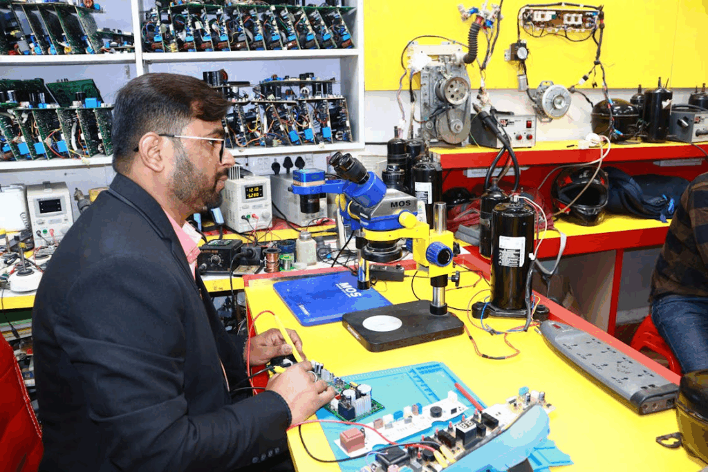 Man Working in Electronics and AC Repair Lab