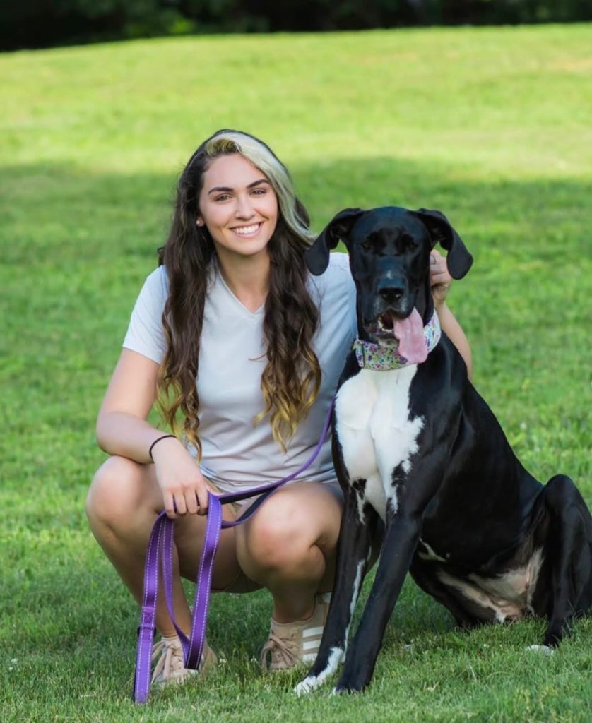 Rayven with her dog on grass