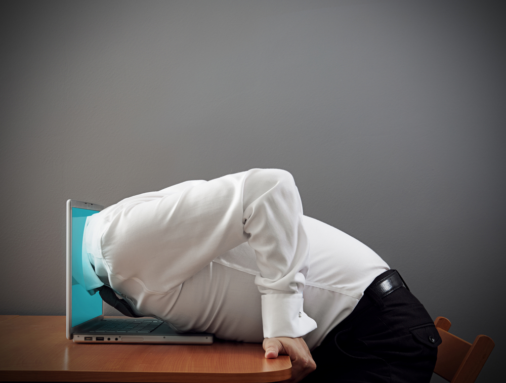 concept photo of internet addiction. man plunging into computer
