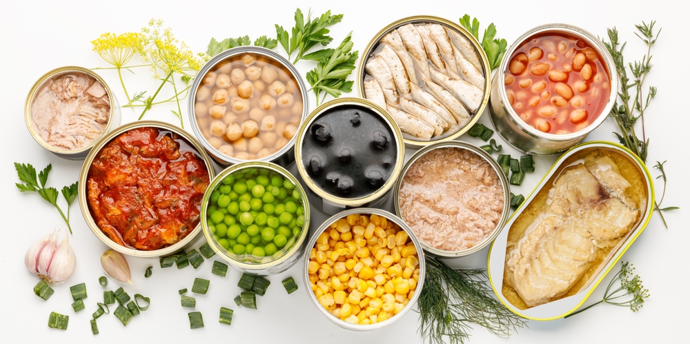 An assortment of processed food with long shelf life, canned fish and vegetables.