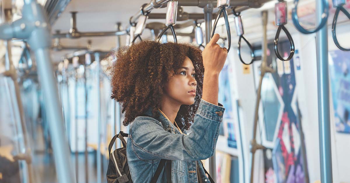 Woman standing in subway car