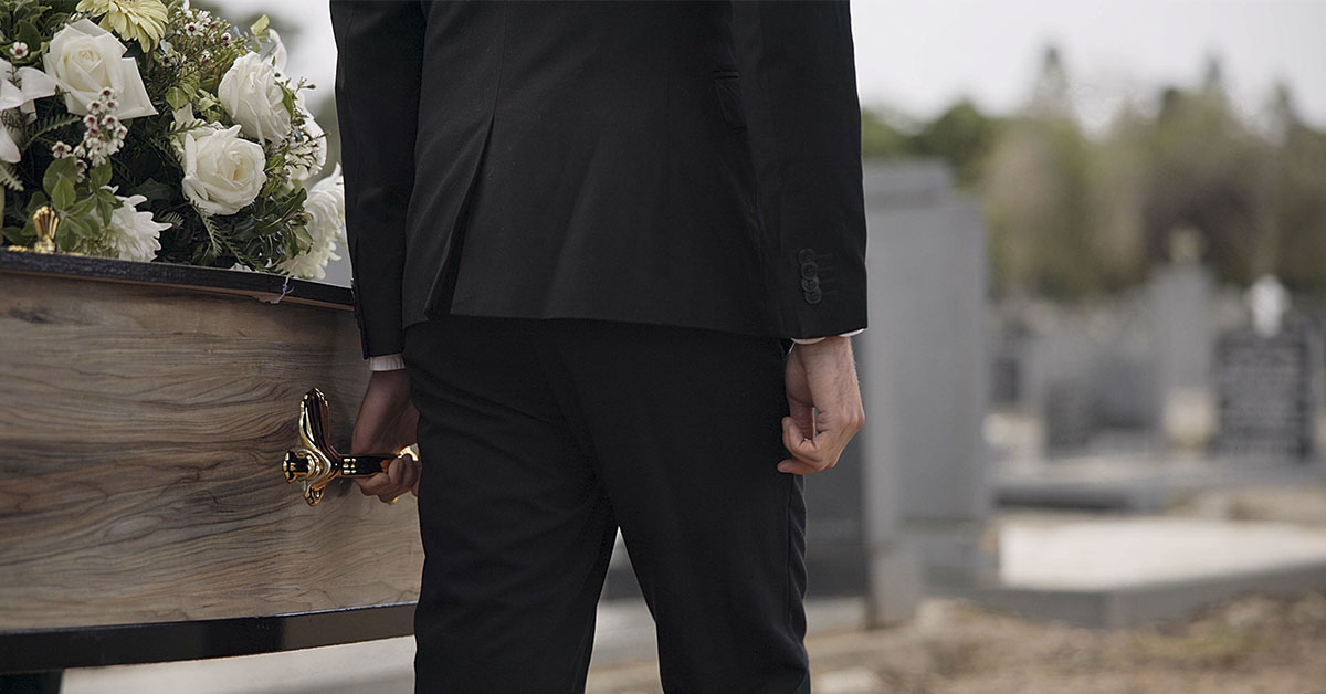 Pallbearers carrying a coffin at a funeral