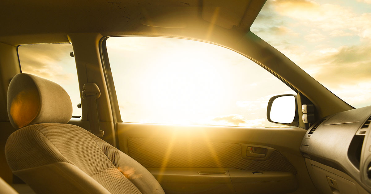 sun piercing through window inside a hot car