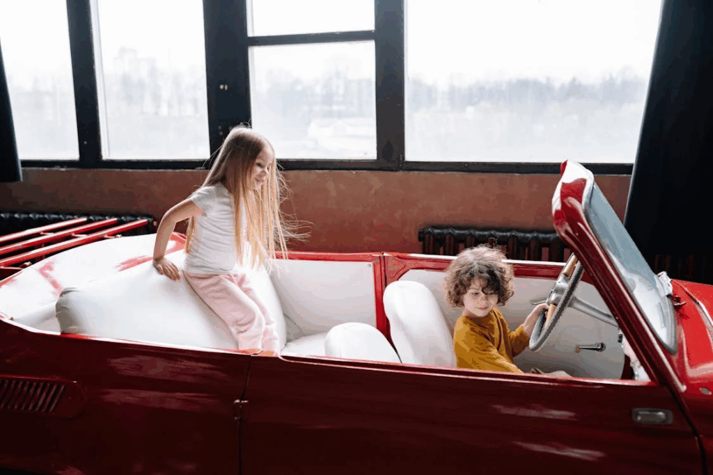Kids Sitting in Car in Photo Studio