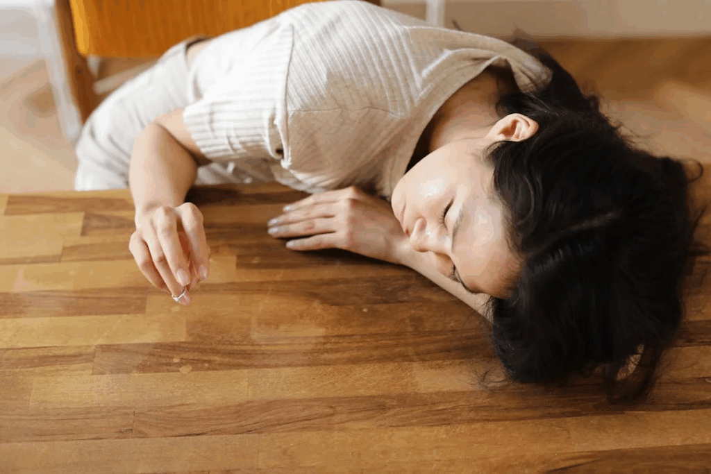 A Woman Sulking on the Wooden Table