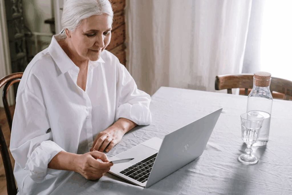 An Older Woman Using A Laptop