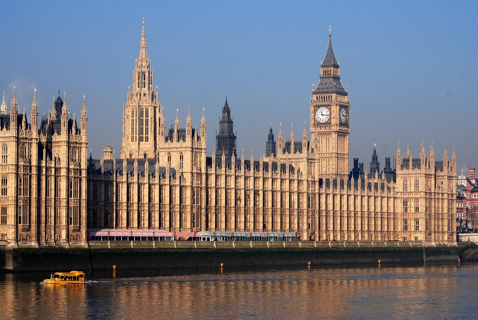 Here's an alternative text for the new Image 3:
"The Palace of Westminster and Big Ben in London bathed in golden evening light, viewed across the River Thames. This historic building houses the UK Parliament where the Online Safety Act was passed, establishing the regulatory framework for online age verification requirements. A small boat can be seen on the river's reflective surface. This iconic British landmark represents the government authority behind the new digital safety legislation.