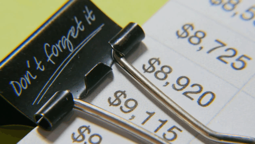 A Close-Up Shot of a Document with a Binder Clip
