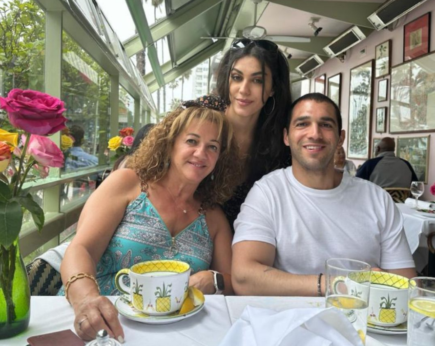 Adam with his mother and sister