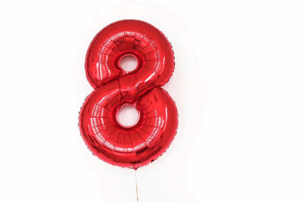 A shiny red foil number 8 balloon similar to the one involved in Joshua's tragic death. This seemingly innocent birthday decoration led to fatal helium asphyxiation when the 8-year-old boy inhaled its contents.