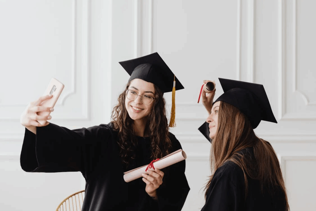 Women Taking Photos Wearing their Academic Dress