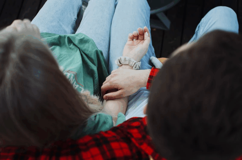 Hand of a Man on a Woman's Arm