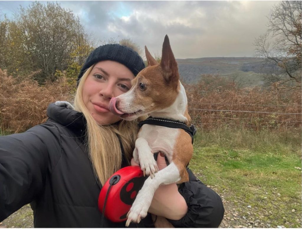 Melissa with dog smiling