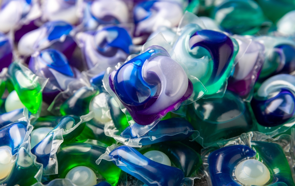 Washing capsules. Capsules with liquid powder for washing things in the washing machine. Capsules background.