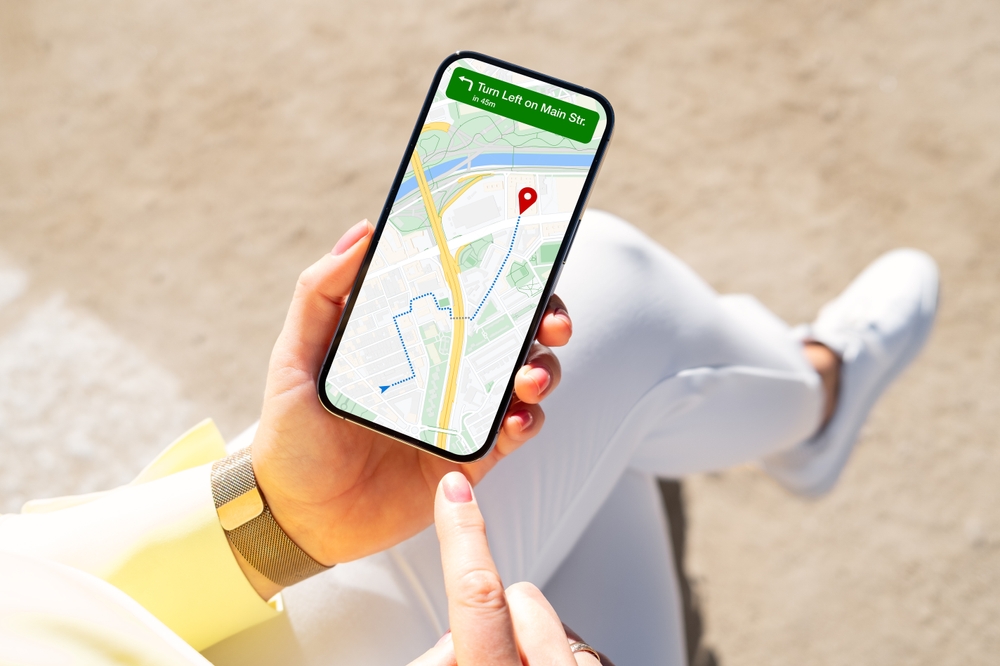 Person viewing city map on mobile phone for navigation directions