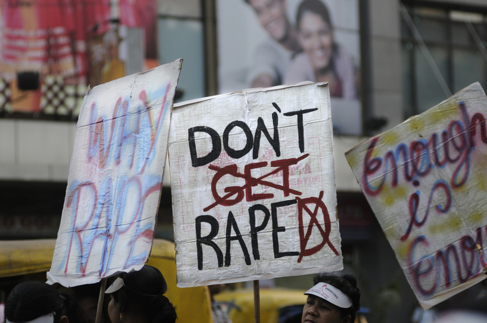 KOLKATA - DECEMBER 16 :A woman holding a banner saying "don't get raped" during a rally to remember the gang raped victim from New Delhi in the year 2012 - on December 16, 2014 in Kolkata , India.