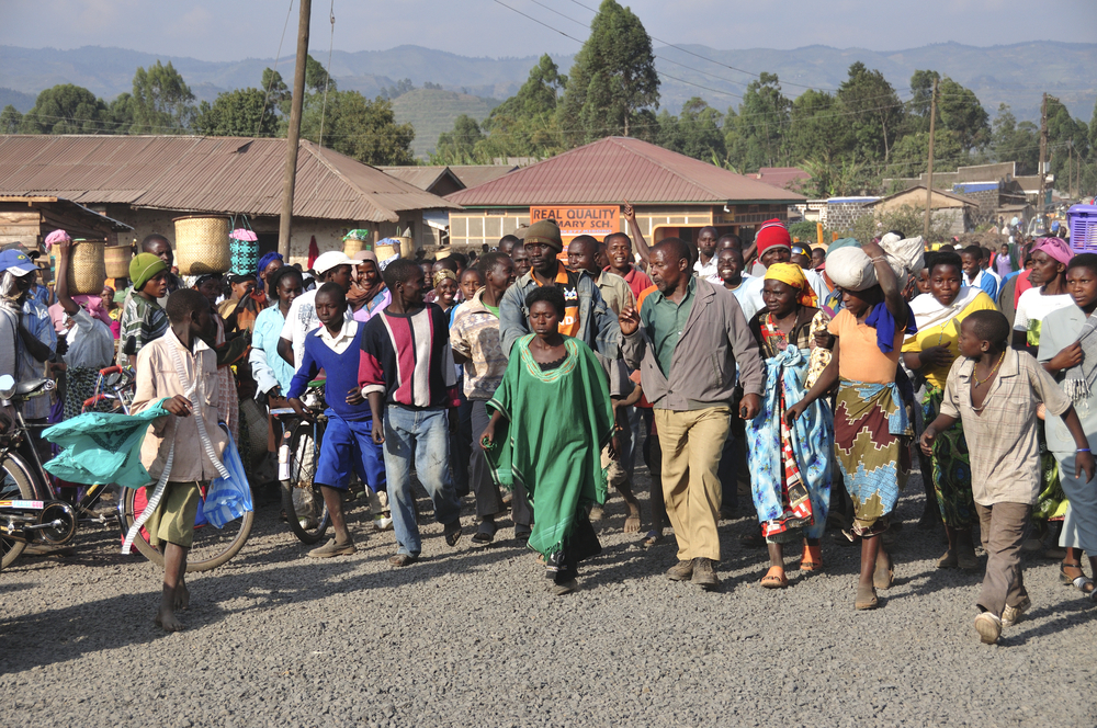 LAKE BUNYONYI, UGANDA/AFRICA - 07 19 2010: [Angry mob following a woman accused of adultery]