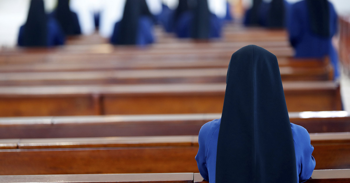 Nun sitting in church
