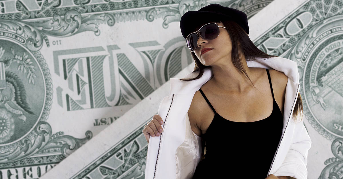 Sexy young woman with dollar bills in the background