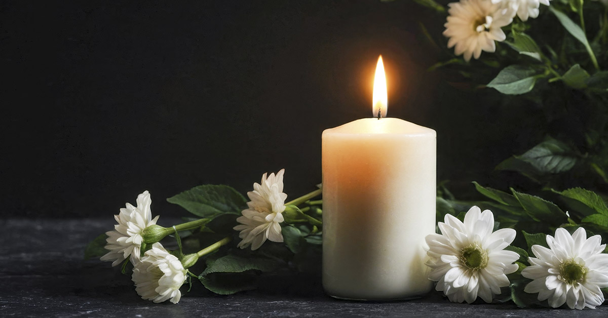 Candle and flowers. Mourning concept