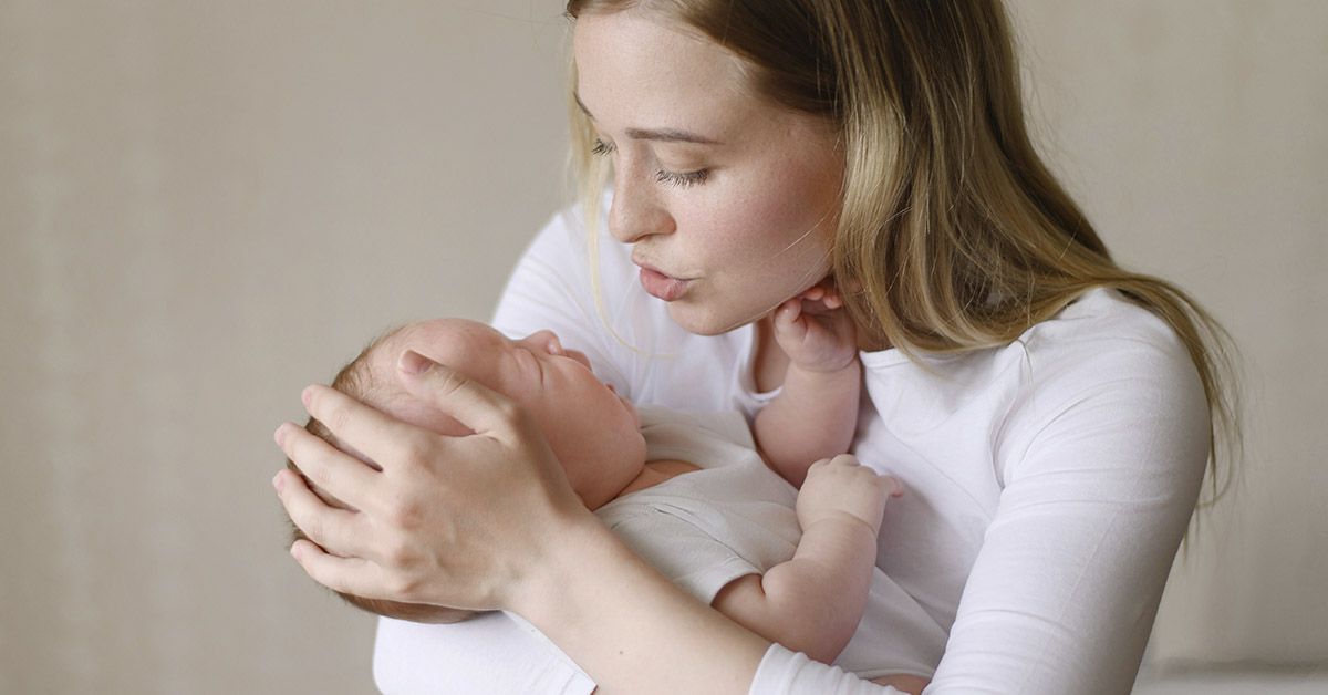 mother comforting her crying baby