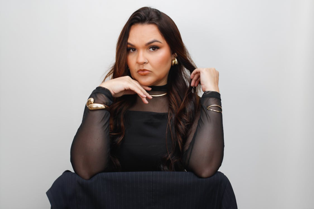 Elegant Woman in Black with Gold Accessories