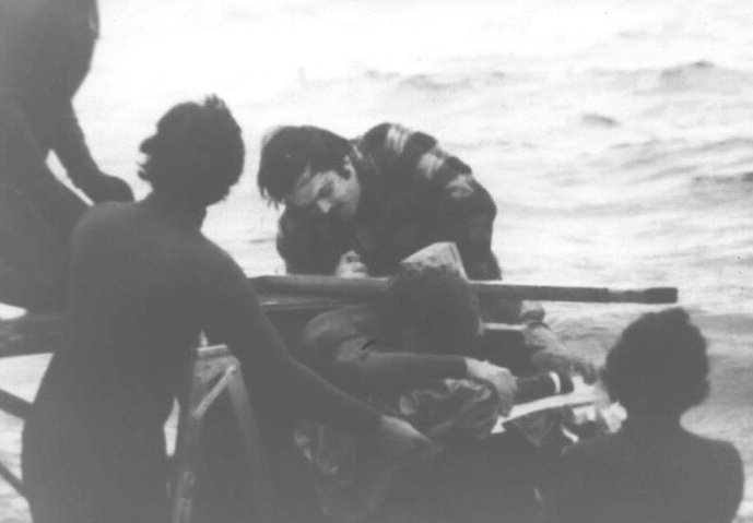 Jim Harrington climbing the pier while the camera rolls. Man to the right, back to camera, is Steven Spielberg