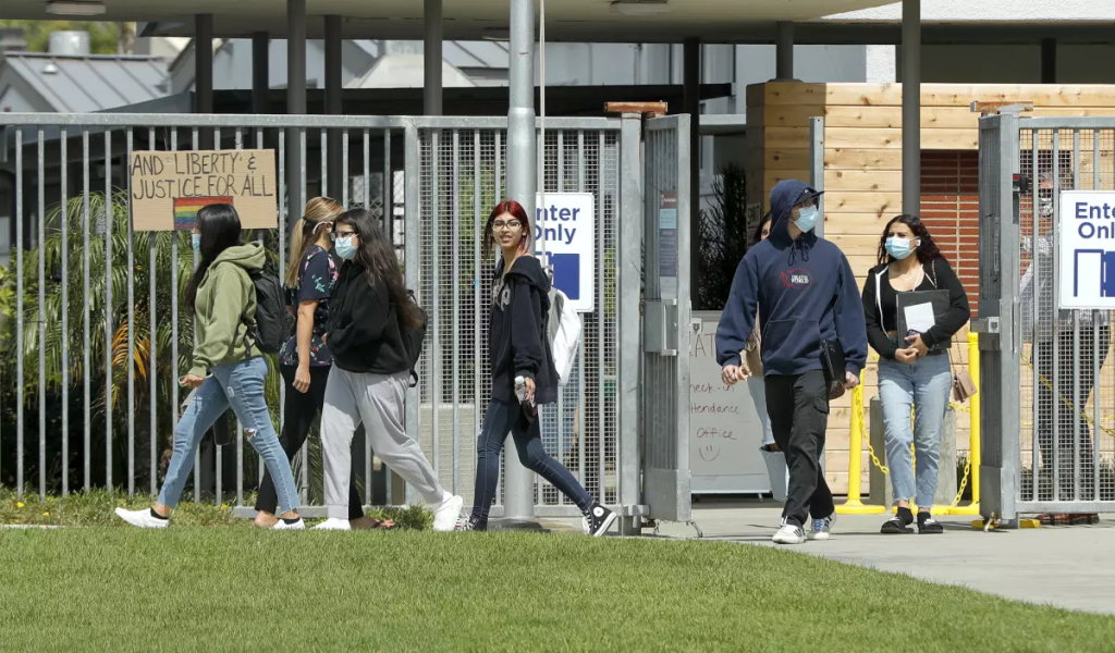 Students leave for the day at Back Bay High School
