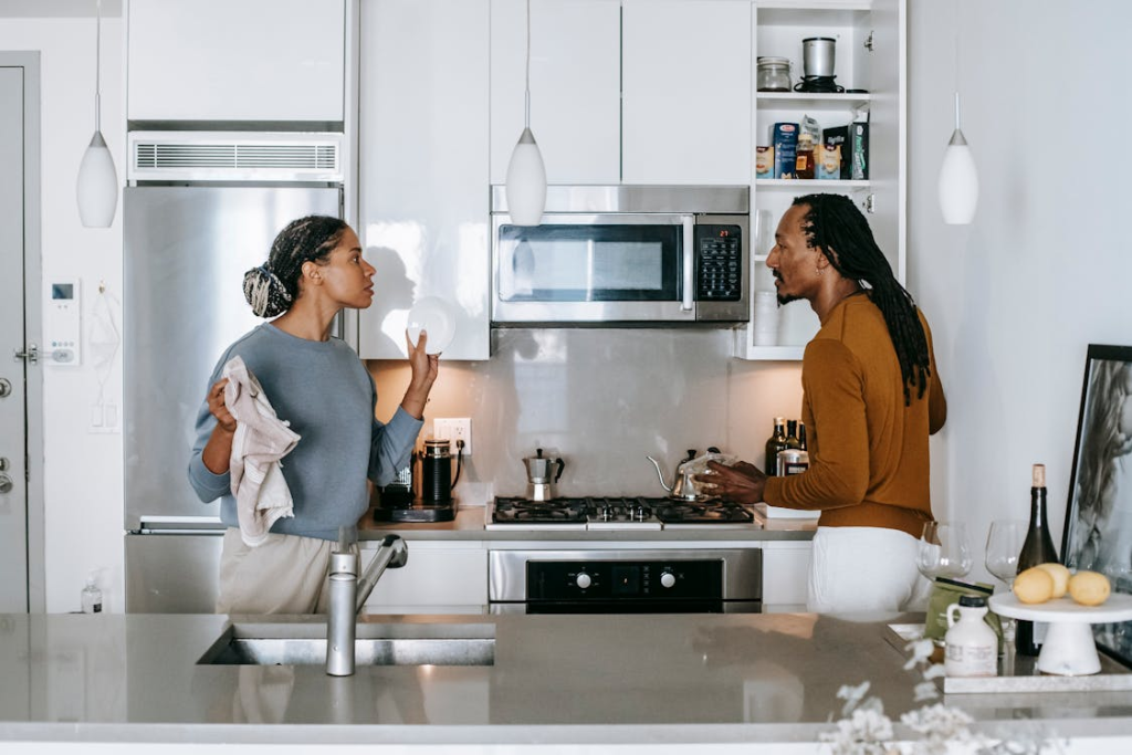 couple having conflict in kitchen at home after mentioning divorce
