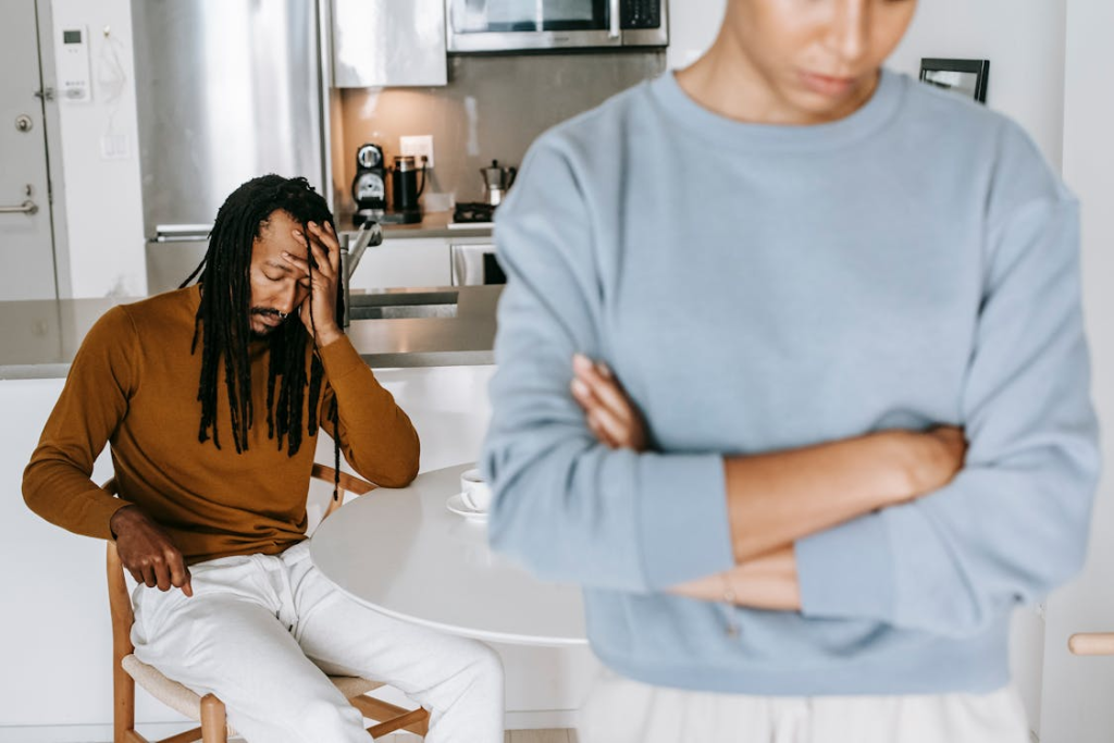 upset couple talking in kitchen after mention of divorce