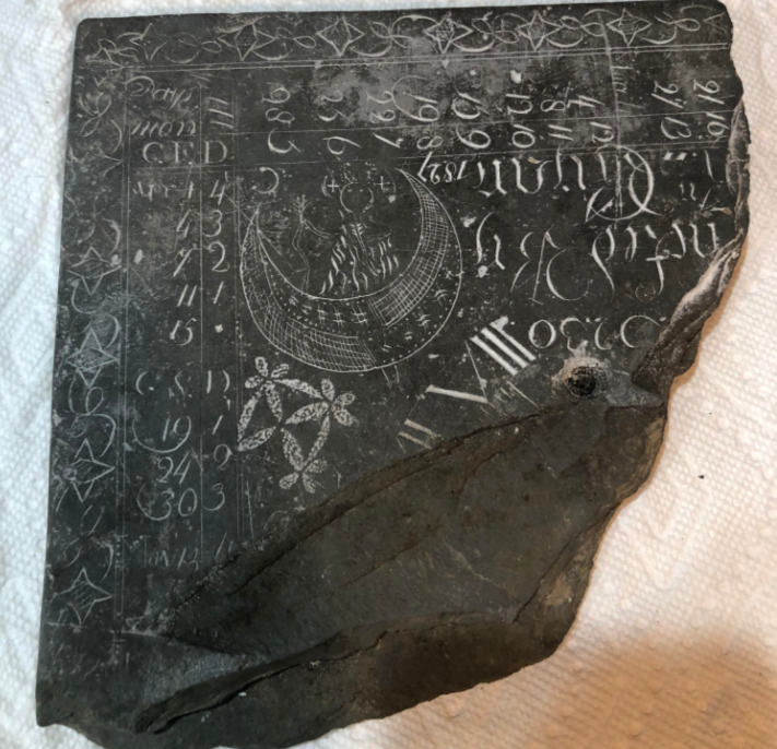 The mysterious object in the image is a practice gravestone carving