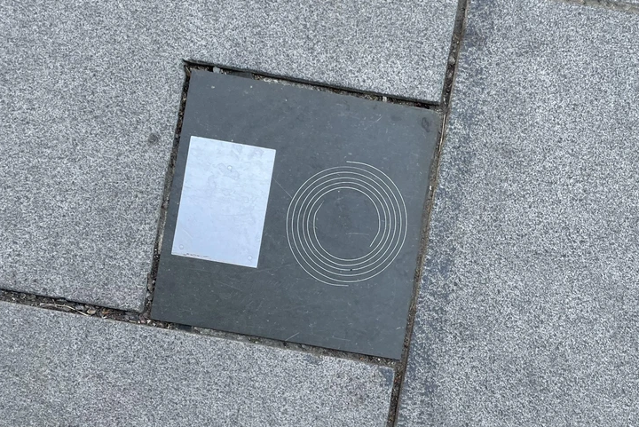 The mysterious object embedded in the pavement is an ice and snow sensor