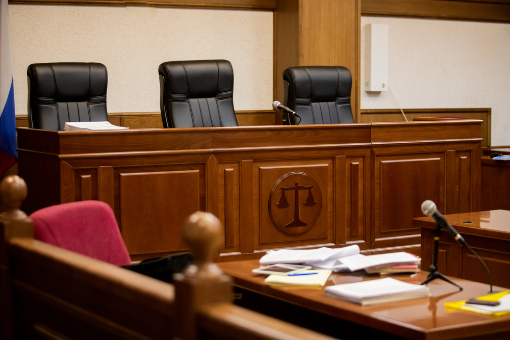 A courtroom in a Russian court, an empty judge's chair
