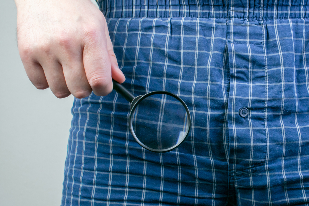 The main subject is out of focus, small man Micropenis Symptoms, Causes, Treatments, problems enlargement pills, relationships, male hand hold magnifying glass
