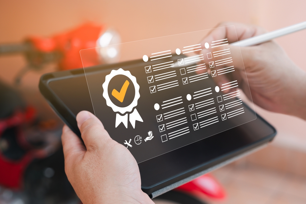 Standards quality control assurance of Vehicle service warranty business technology concept, Officer use tablets checklist of the terms and conditions of the quality guarantee checklist online