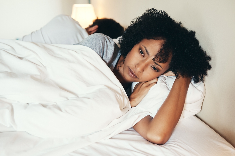 Black woman, couple and ignore in bedroom for fight, angry and stress for argument on divorce. People, betrayal and husband for silent treatment in toxic relationship, affair and home for conflict