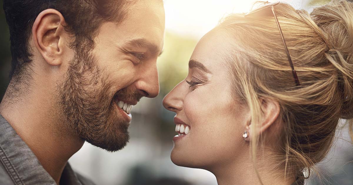 loving couple smiling and staring into each others eyes