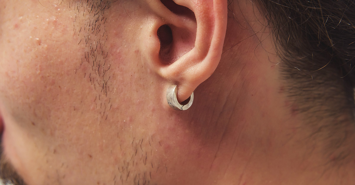 Discover the hidden symbolism of men’s earrings and why this simple accessory reveals more than just fashion flair.