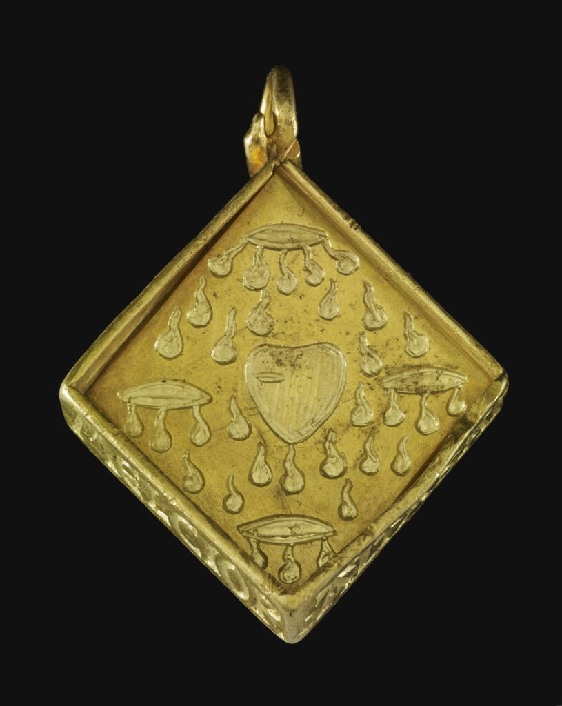 Back panel of the pendant engraved with the five wounds of Christ and a profusion of droplets