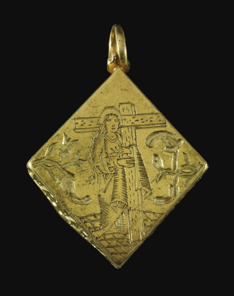 Close up view of the front panel of a pendant, depicting the Virgin Mary