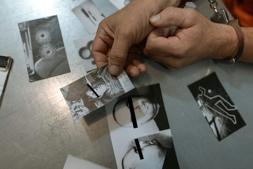 Person Holding Black Framed Eyeglasses
