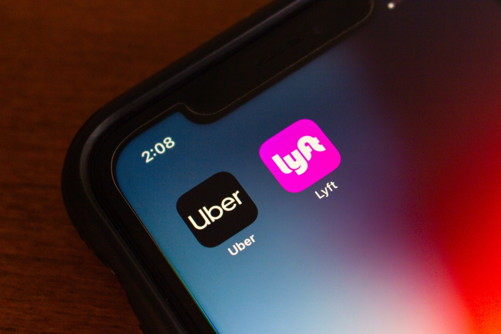 Vancouver, CANADA - Jul 15 2024 : Uber and Lyft apps seen in an iPhone screen. Leading ridesharing companies concept image
