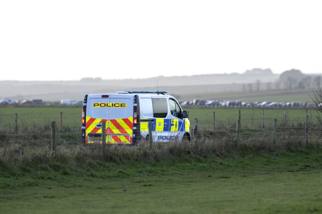 Police van stationed in a rural area, like the backup teams ready to respond when officers faced harassment.
